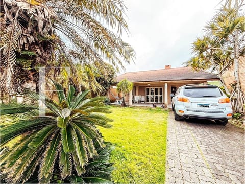 Casa com 120m², 3 dormitórios, 3 suítes, 2 vagas, no bairro Noiva do Mar em Xangri-Lá