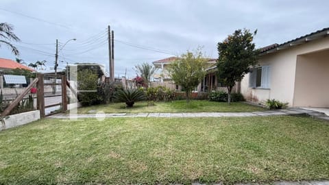 Casa com 150m², 4 dormitórios, 3 vagas, no bairro Centro em Xangri-Lá
