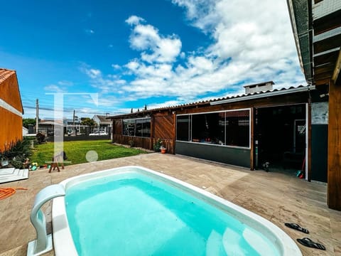 Casa com 360m², 3 dormitórios, 2 vagas, no bairro Rainha do Mar em Xangri-Lá