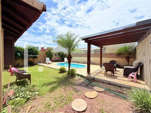 Casa com 128m², 3 dormitórios, 1 suíte, 2 vagas, no bairro Noiva do Mar em Xangri-Lá